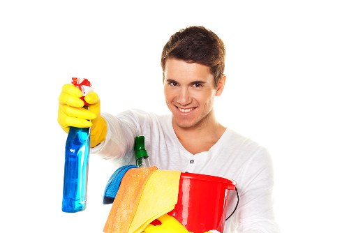 Spot cleaning a carpet stain in a Merton residential property